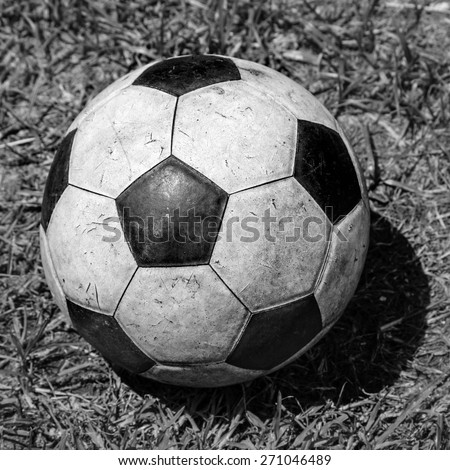 Old Soccer grunge ball on grass background. grayscale sad old memory moment