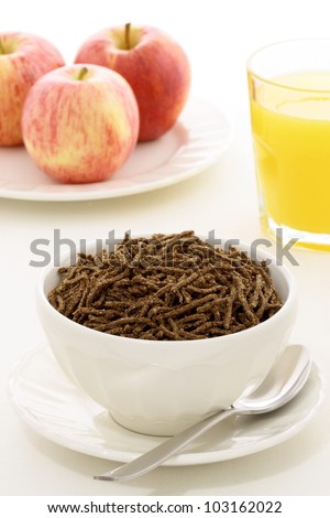 Delicious and nutritious cereal, orange juice  and apple, high in bran, high in fiber, served in a beautiful  French Cafe au Lait Bowl with wide rims. In place of handles.
