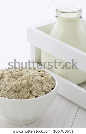 Delicious and nutritious lightly toasted breakfast cereal rice flakes and milk bottle