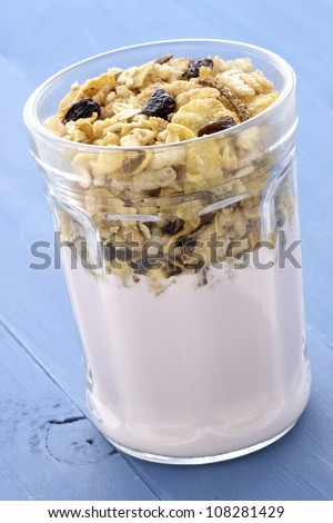 Fresh, healthy and delicious yogurt parfait in vintage French jar, the perfect breakfast, snack or dessert.