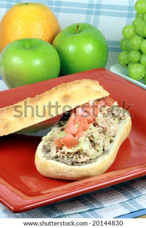 artichoke tuna sandwich with fresh organic fruits