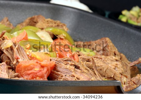 perfectly made mexican machaca beef  delicious aromatic slow down cooked  with hot  and sweet peppers