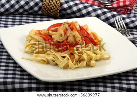 Gourmet exquisite halibut  fettuccine pasta  on fancy dinner plate