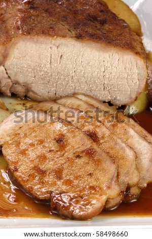 fine pork tenderloin slow roasted  with fresh green apple wedges and apple sauce