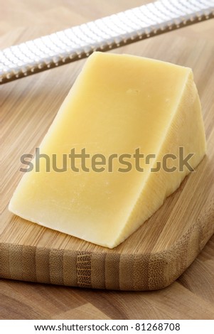 named after an area in Italy, parmigiano reggiano or parmesan cheese is one of the world\'s most famous and delicious cheeses.  shallow d.o.f