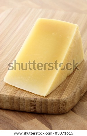 named after an area in Italy parmigiano reggiano or parmesan cheese is one of the world's most famous and delicious cheeses.  shallow d.o.f