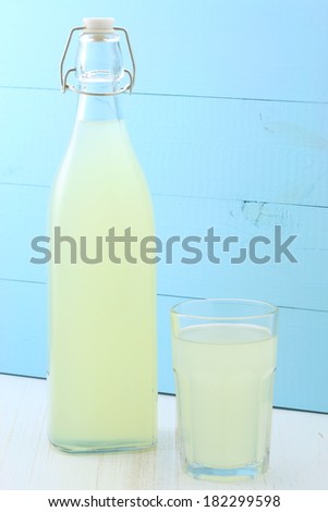 delicious and nutritious, organic lemonade on vintage bottle and glass