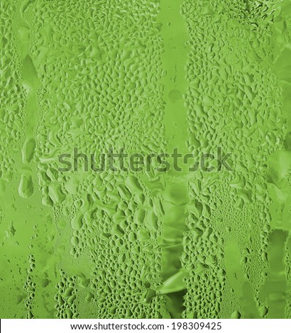 close-up of water drop on water jug in green  color for background