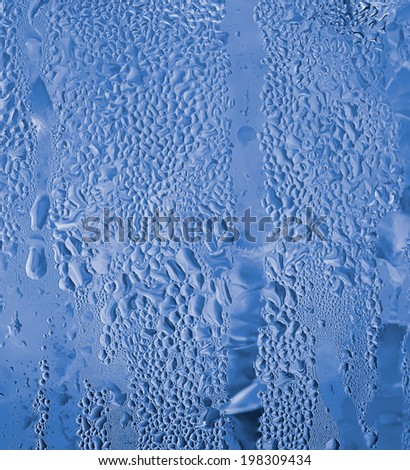 close-up of water drop on water jug in blue color for background