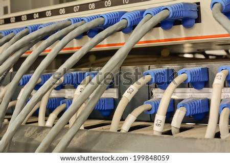 close-up of  ethernet cables connected to computer  internet server with many dust; lack of maintenance
