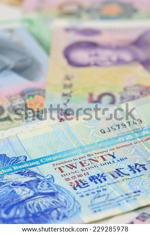 Hongkong dollars  and chinese money (renminbi) - Yuan bank notes. Concept photo for money, banking ,currency and foreign exchange rates