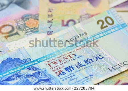 Hongkong dollars  and chinese money (renminbi) - Yuan bank notes. Concept photo for money, banking ,currency and foreign exchange rates