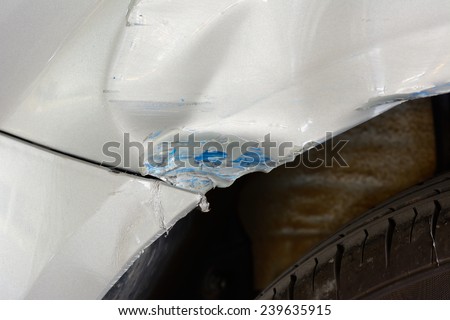 closeup of  generic car with dented rear bumper , Minor accident result - fender bender.