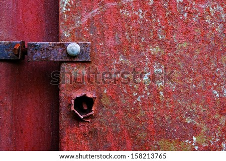 Old painted metal construction in red.
