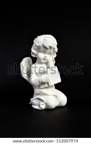 Angel with book on black card stock A funereal element