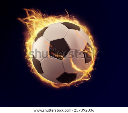 soccer ball or football on fire, football in orange flame can be use in extreme sport title or print ad