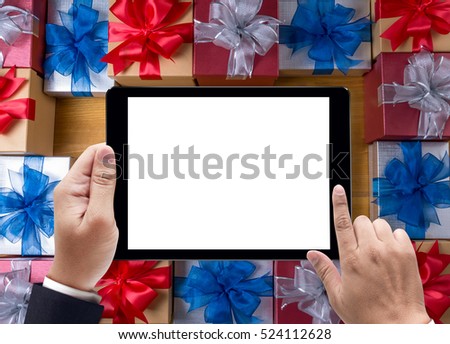 BOX gift  and small gift wrapped , presents and Christmas ,  man using ipad and gifts, celebrations and Christmas concept