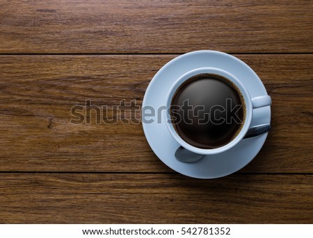 White cup of coffee on vintage wood. Top view ,  cup on wooden table. View from top ,   break or breakfast