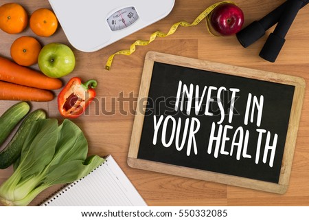 Invest in your health , Healthy lifestyle concept with diet and fitness , Get fit in 2017 , fitness equipment and healthy food