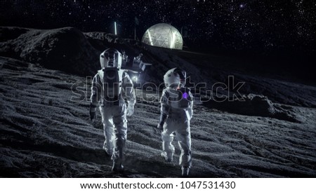 Following Shot of Two Astronauts in Space Suits Walk on the Alien Planet Looking at the Sky. In the Background Base with Geodesic Dome. Other Worlds Colonization and Space Travel Concept.