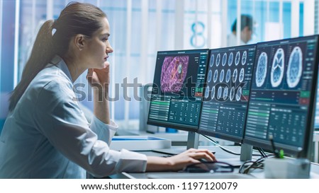 Female Medical Research Scientist Working with Brain Scans on Her Personal Computer. Modern Laboratory Working on Neurophysiology, Science,  Neuropharmacology. Understanding Human Brain.