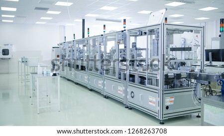 Shot of Sterile Precision Manufacturing Laboratory with 3D Printers, Super Computers and other Electrical Equipment and Machines suitable for Pharmaceutics, Biotechnology and Semiconductor Researches.