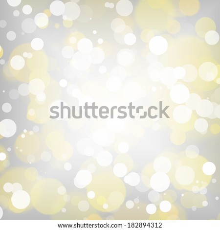 Bright white and gold bokeh on silver background