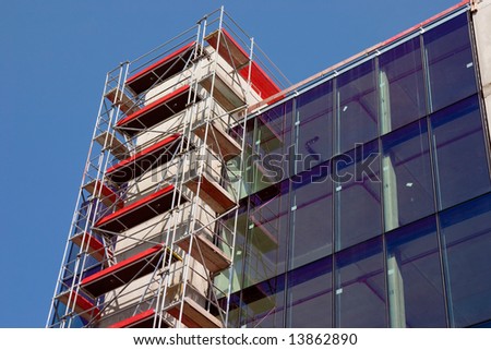 Empty new modern glass house with red stages in Luxembourg