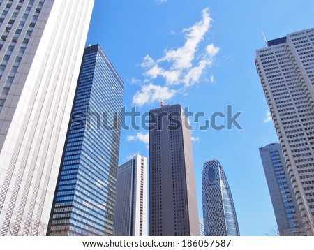 Tokyo JAPAN - March 10, 2014: Skyscrapers in Tokyo Japan with blue sky background.