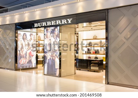 BANGKOK - JUNE 17: Burberry Store in Suvarnabhumi Airport, Bangkok on Jun 17, 2014. It is a British luxury fashion house, distributing clothing, fashion accessories, fragrances and cosmetics.