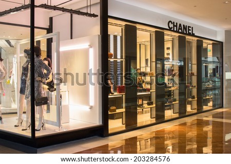 SINGAPORE - JUNE 19: Chanel Store in Marina Bay Sands Shopping mall, Singapore on June 19, 2014. Chanel is a high fashion house, specializes in clothes, luxury goods and fashion accessories.