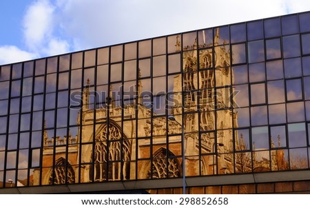 Reflection of Holy Trinity Church, Kingston upon Hull, UK, in office block windows