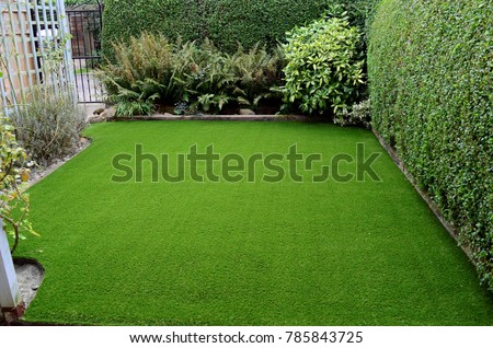 Newly laid artificial lawn in small front garden, East Yorkshire, UK