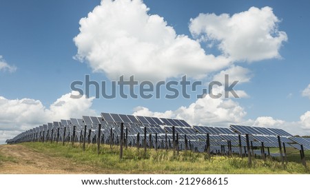 South Central Wisconsin - August 19, 2014  Solar panel farm in south central Wisconsin with clouds and sky.