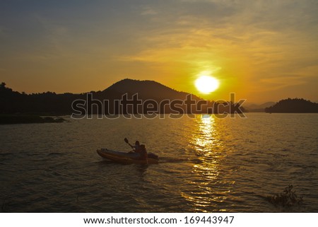 Abstract nature, Kayaks and sunset, in Lake Dam Kaeng Krachan, Thailand