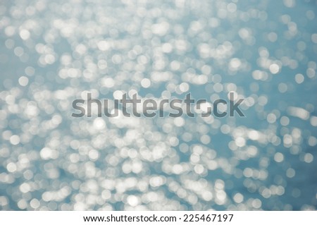 Bokeh sparkling blue sea water surface