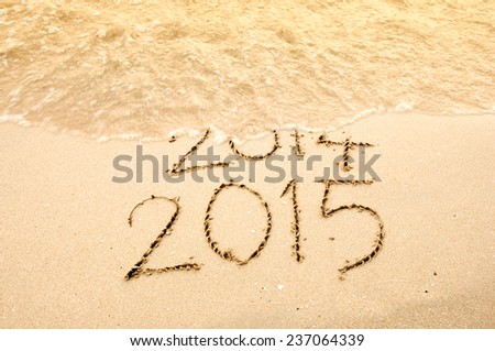 Year 2015 Coming writing on the beach
