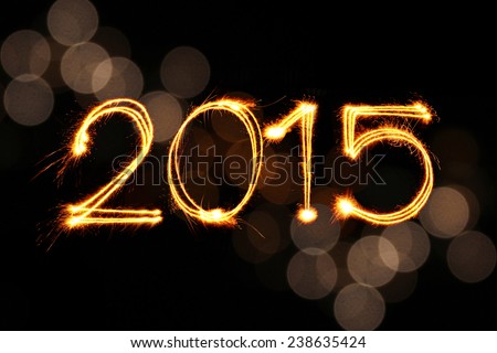 New Year 2015 sparkle firework with defocused dirty circle light blur bokeh background