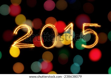New Year 2015 sparkle firework with defocused dirty circle light blur bokeh background