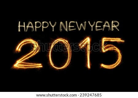 Happy New Year 2015 writing sparkle firework on black background