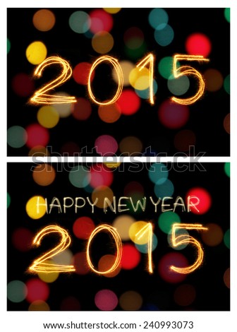 Happy new year 2015 writing sparkles firework with dirty defocused light blur bokeh background