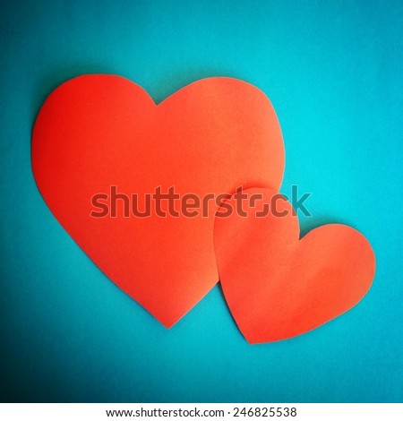 Love Hearts paper for Valentines day on complementary color background in vintage tone