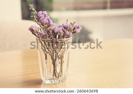Lavender flowers in glass vase in vintage tone