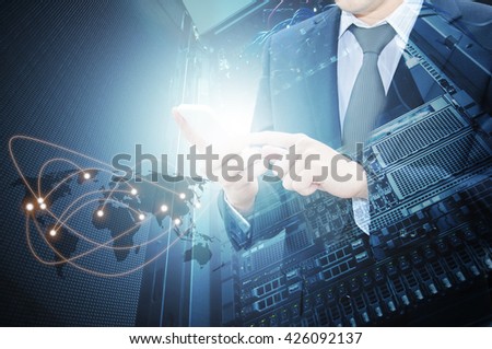 Double exposure of professional businessman using smart phone with servers technology in data center and world map network connection in IT Business concept, world map from NASA