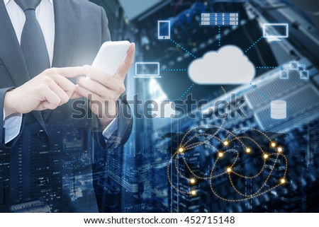 Double exposure of professional businessman connecting cloud internet smart phone with servers technology and connect world network in IT Business concept, element of this image furnished by NASA