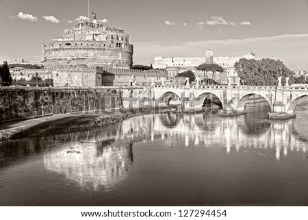 View on famous Saint Angel castle and bridge over the Tiber river in Rome, Italy.