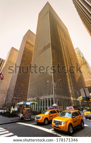 NEW YORK - MARCH 21: City streetlife in point of intersection of 6th Av. and 50th st. near the famous Rockefeller Center on March 21, 2011 in Manhattan, New York City