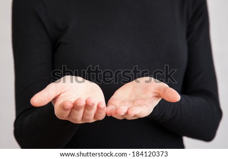 Unrecognizable woman reaching out her empty hands