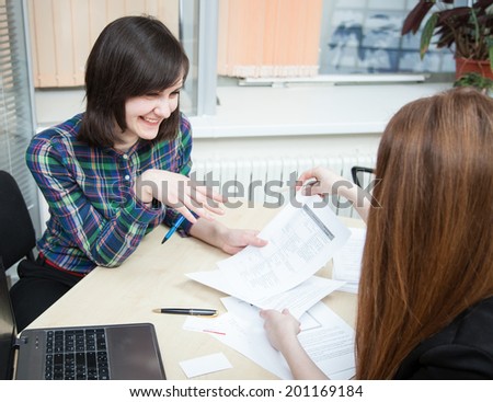 Manager discussing with client in the office