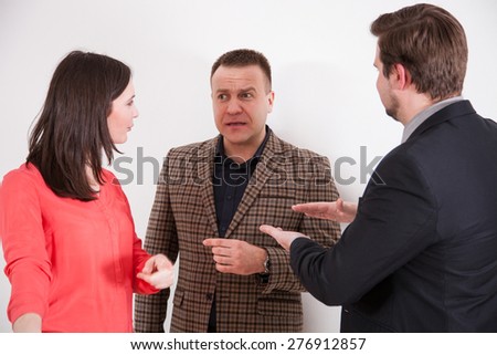Business people holding debate, neutral background